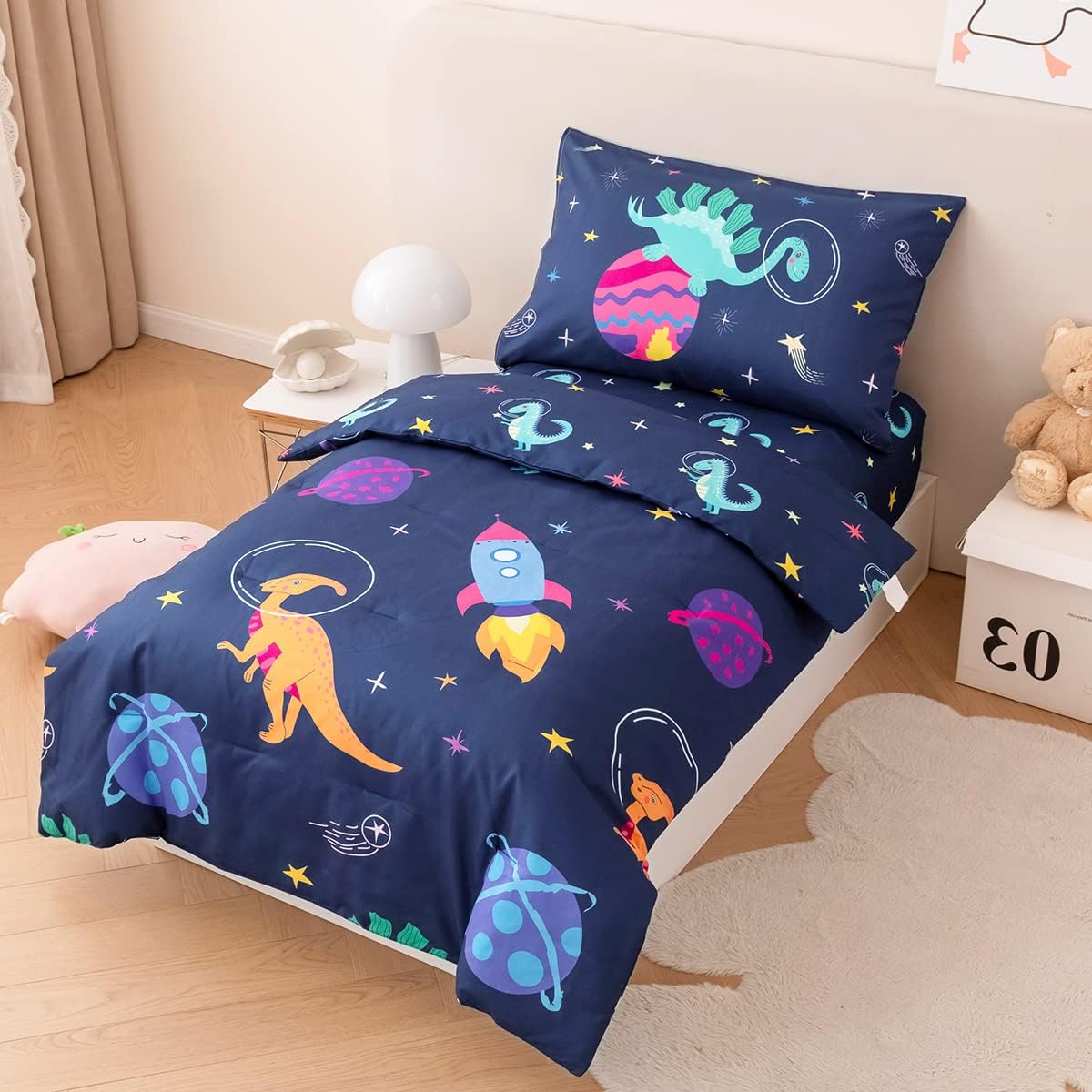 PERFEMET Toddler Bedding Set 4 Pieces Cartoon Dinosaur Planet Printed Bed in A Bag for Boys Girls Reversible Navy Blue Toddler Comforter with Sheet Set for All Season(Navy, Dinosaur/Planet/Rocket)